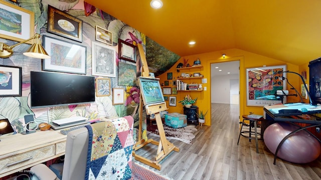 office area with hardwood / wood-style floors and lofted ceiling