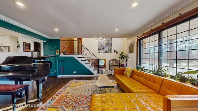 game room featuring crown molding and dark hardwood / wood-style floors