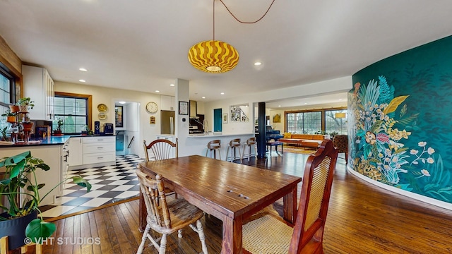 dining area featuring dark hardwood / wood-style floors