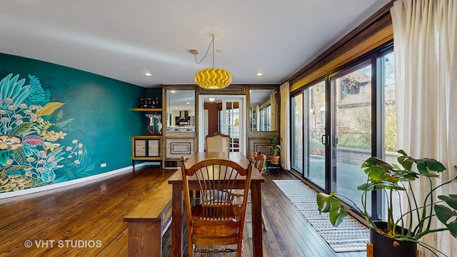 dining space with dark hardwood / wood-style floors