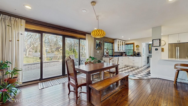 dining space featuring wood-type flooring