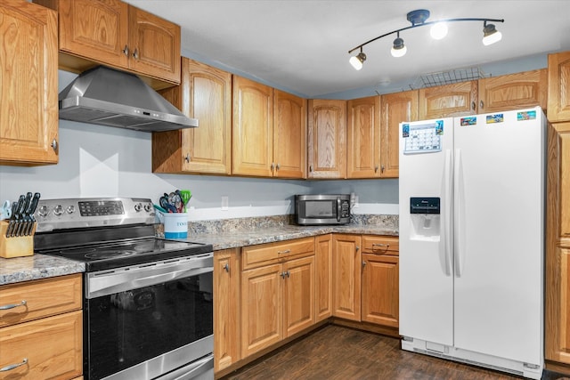 kitchen featuring light stone countertops, ventilation hood, dark hardwood / wood-style flooring, and stainless steel appliances