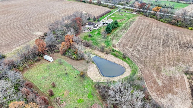 birds eye view of property with a rural view