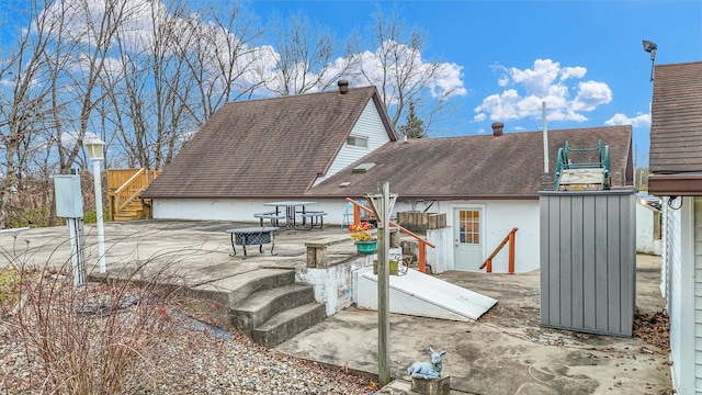 back of house with a patio area