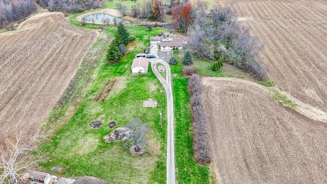 birds eye view of property with a rural view