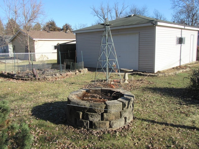 view of outdoor structure featuring a yard and a garage