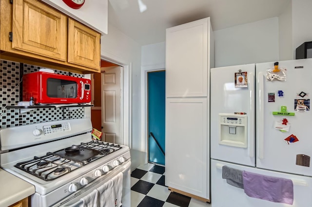 kitchen with white cabinets, white appliances, and backsplash