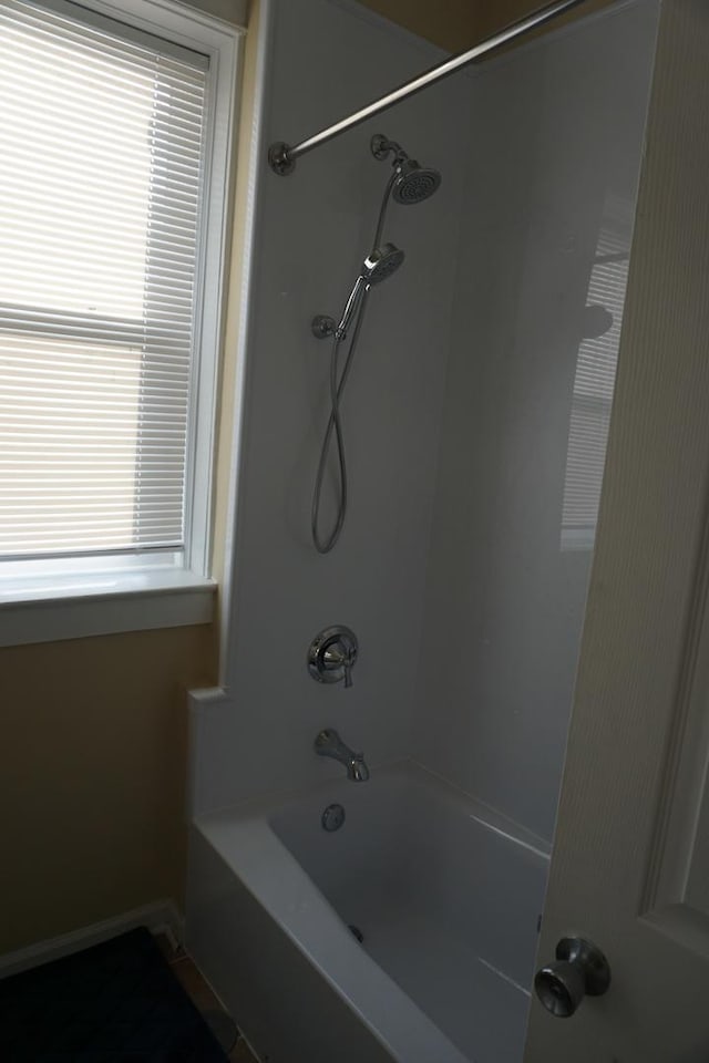 bathroom with shower / bath combination