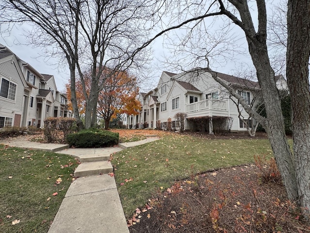 view of home's exterior with a lawn