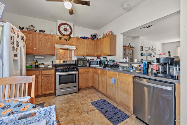 kitchen featuring ceiling fan, sink, and stainless steel appliances