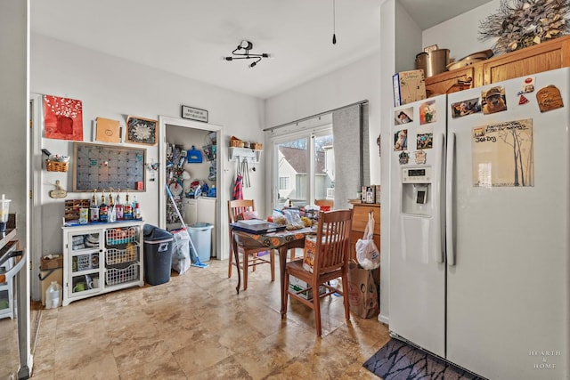 kitchen with white refrigerator with ice dispenser