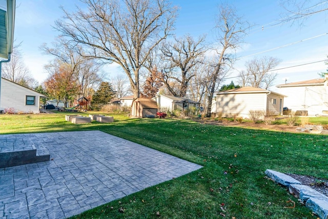 view of yard featuring a shed and a patio