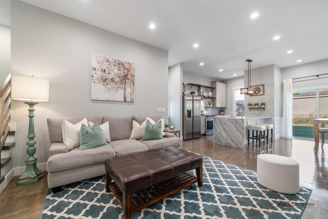 living room featuring hardwood / wood-style floors and sink