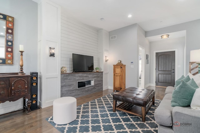 living room with dark hardwood / wood-style flooring