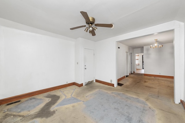 unfurnished room featuring ceiling fan with notable chandelier