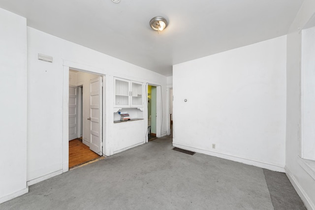 spare room with light colored carpet