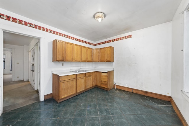 kitchen featuring decorative backsplash and sink