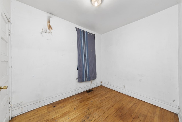 unfurnished room featuring hardwood / wood-style floors