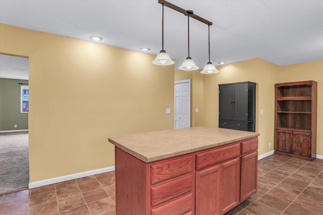 kitchen featuring a center island and decorative light fixtures