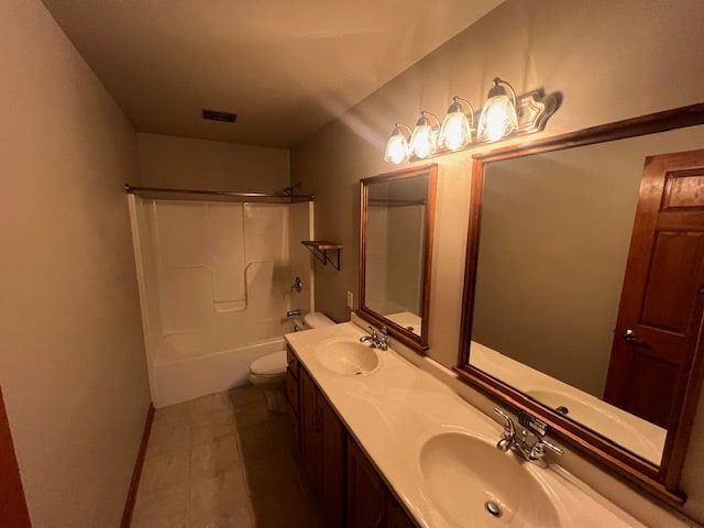 full bathroom featuring tile patterned flooring, vanity, toilet, and washtub / shower combination