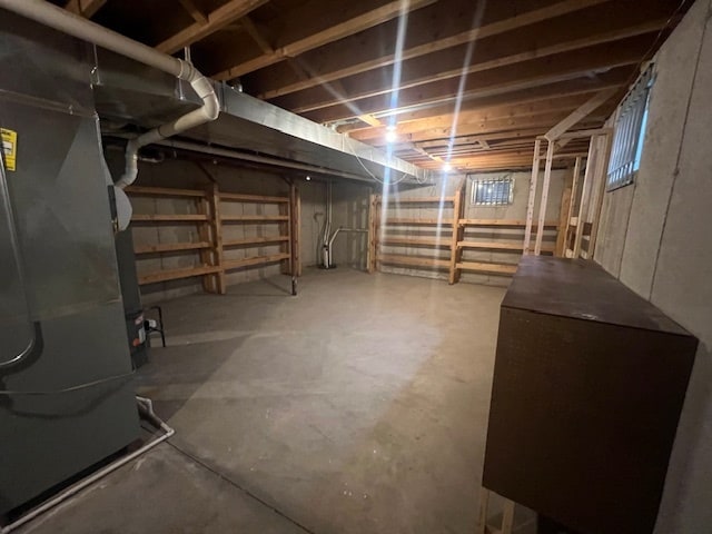 basement featuring heating unit