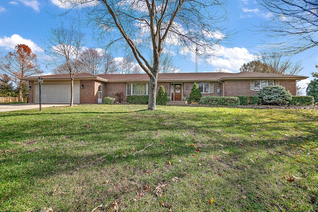 ranch-style home featuring a garage and a front yard