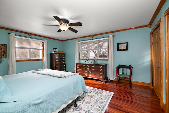 bedroom with ceiling fan, dark hardwood / wood-style flooring, crown molding, and multiple windows