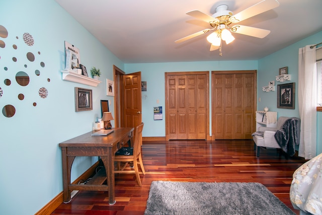 office area featuring dark hardwood / wood-style flooring and ceiling fan