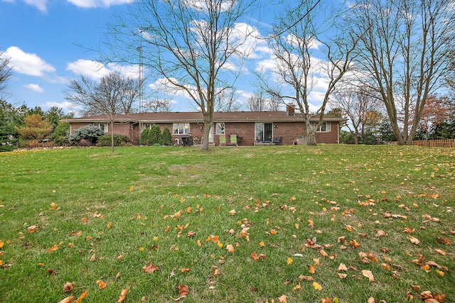 ranch-style house with a front lawn