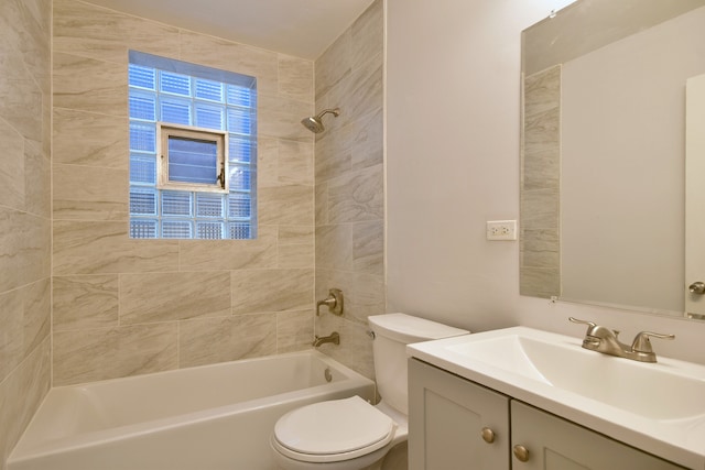 full bathroom with vanity, toilet, and tiled shower / bath