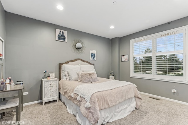 carpeted bedroom featuring baseboards, visible vents, and recessed lighting