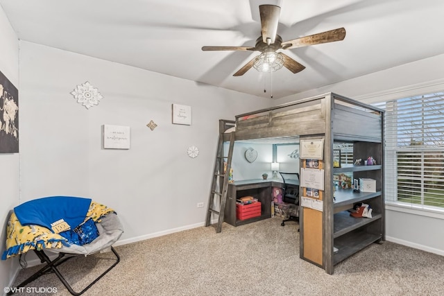 bedroom with a ceiling fan, baseboards, and carpet flooring