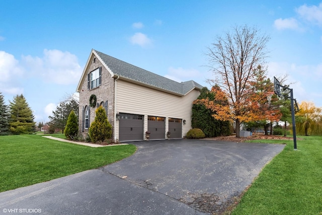 view of side of property with aphalt driveway, roof with shingles, a yard, and an attached garage