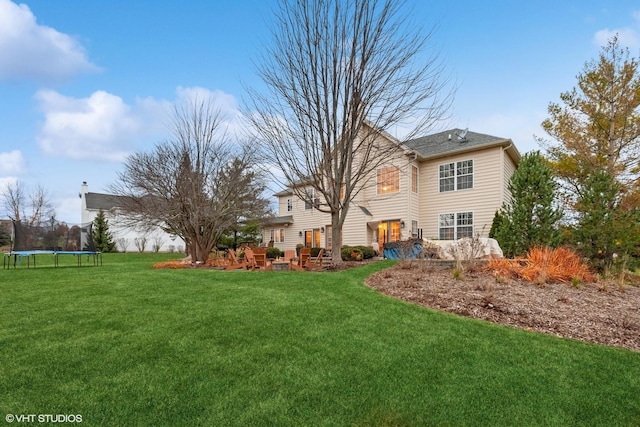 view of yard featuring a patio area and a trampoline