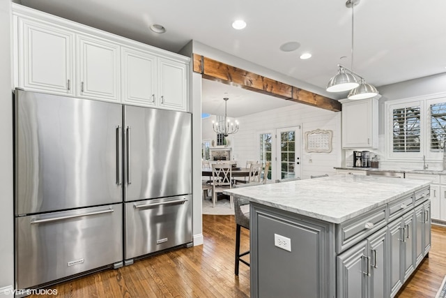 kitchen featuring appliances with stainless steel finishes, gray cabinets, and white cabinetry