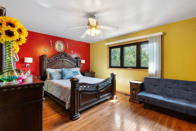 bedroom featuring hardwood / wood-style floors and ceiling fan