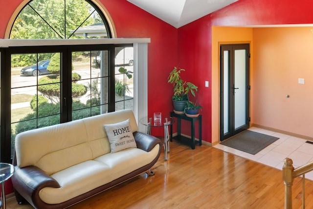 sitting room featuring lofted ceiling and hardwood / wood-style flooring