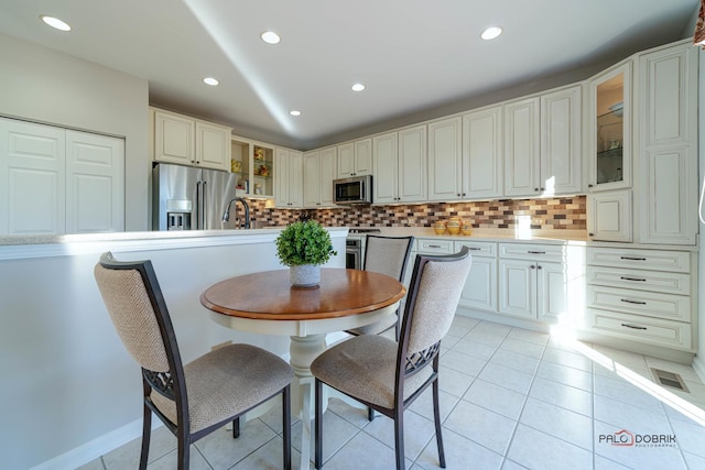 tiled dining space with sink