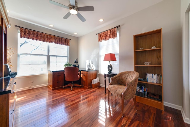 home office with dark hardwood / wood-style floors and ceiling fan