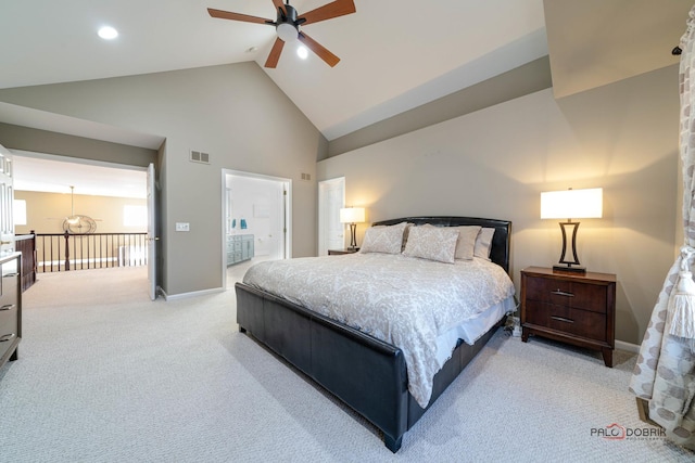 carpeted bedroom featuring connected bathroom, high vaulted ceiling, and ceiling fan