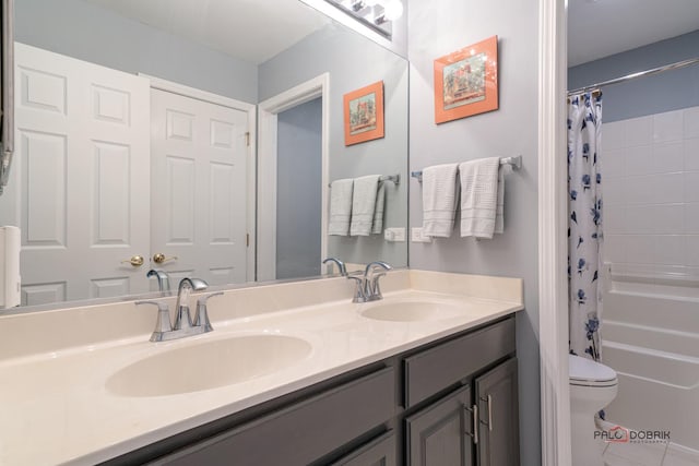 full bathroom with vanity, toilet, and shower / bath combo