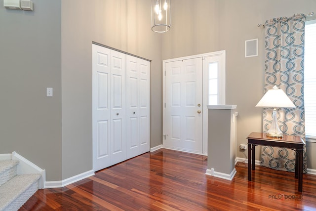 foyer entrance featuring dark hardwood / wood-style floors