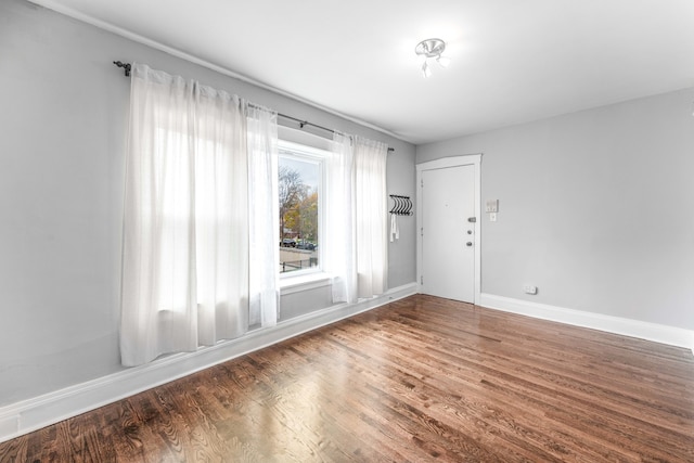 empty room featuring dark hardwood / wood-style floors