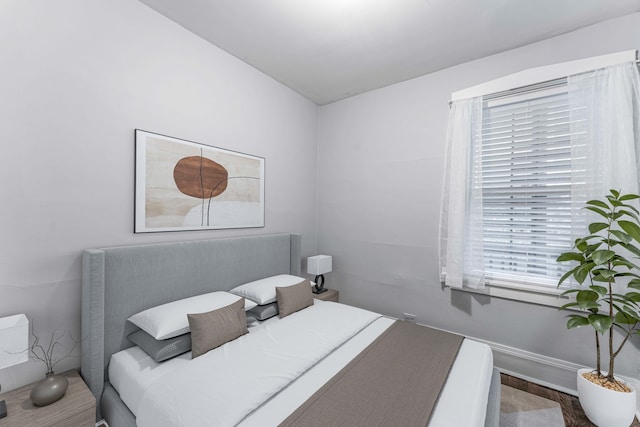 bedroom featuring wood-type flooring