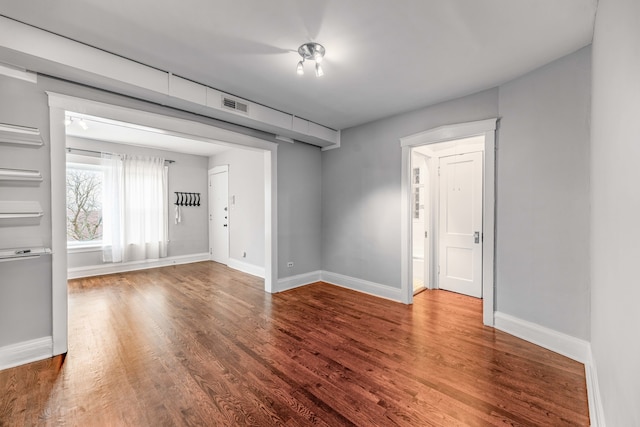 spare room with hardwood / wood-style flooring