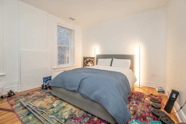 bedroom with light hardwood / wood-style floors