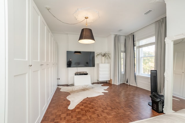 unfurnished living room featuring parquet floors and ornamental molding