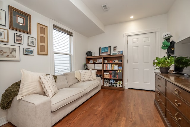 living room featuring dark hardwood / wood-style floors