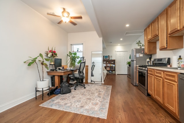 kitchen featuring ceiling fan, dark hardwood / wood-style floors, and appliances with stainless steel finishes