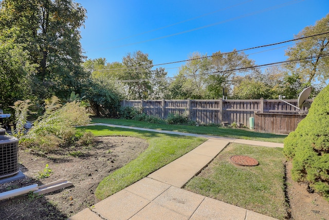 view of yard featuring central AC unit